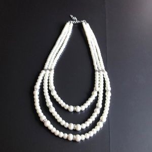 Pseudo pearl necklace.
